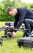 Picture of man working on drone.